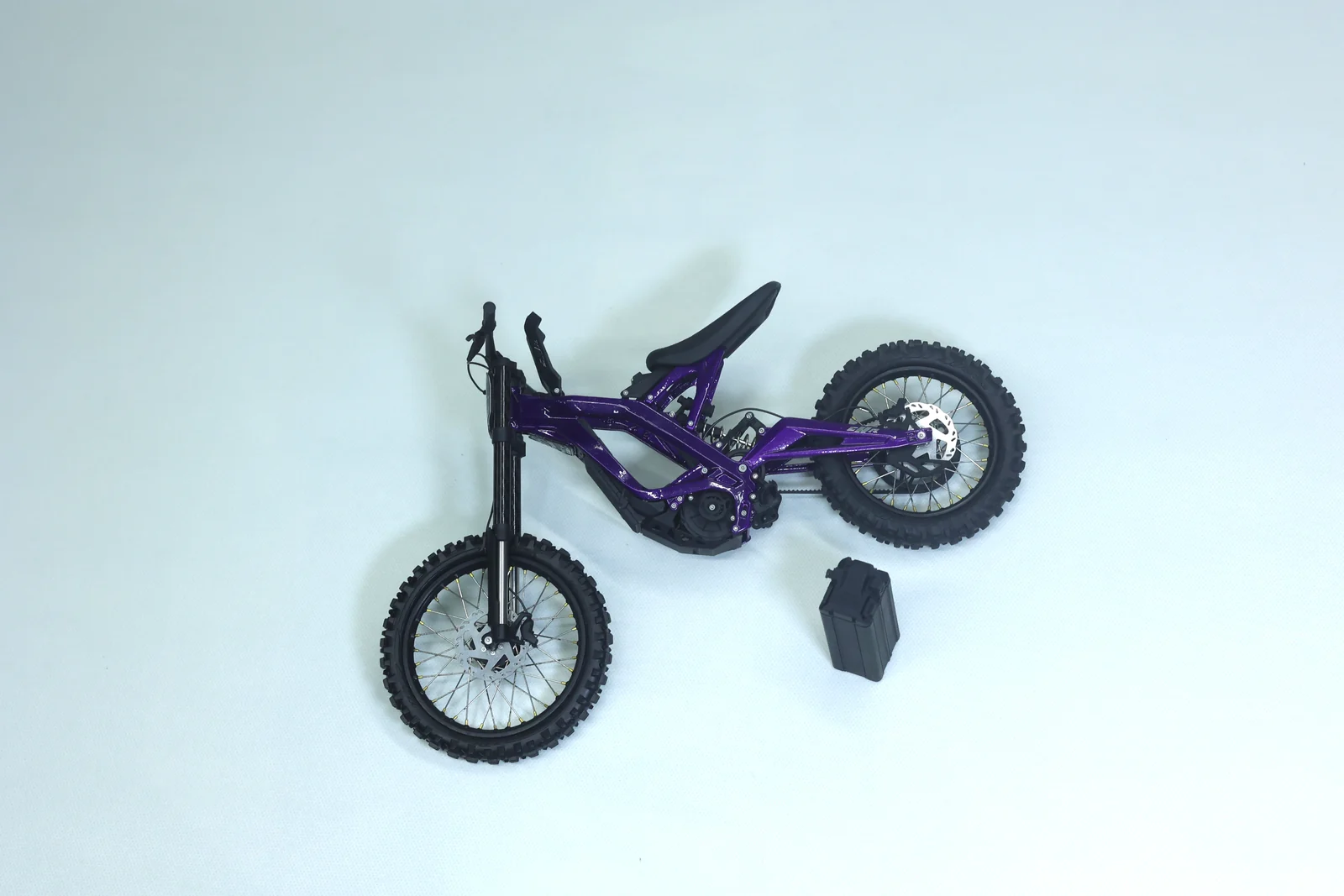 Purple model with the removable model battery component placed beside it
