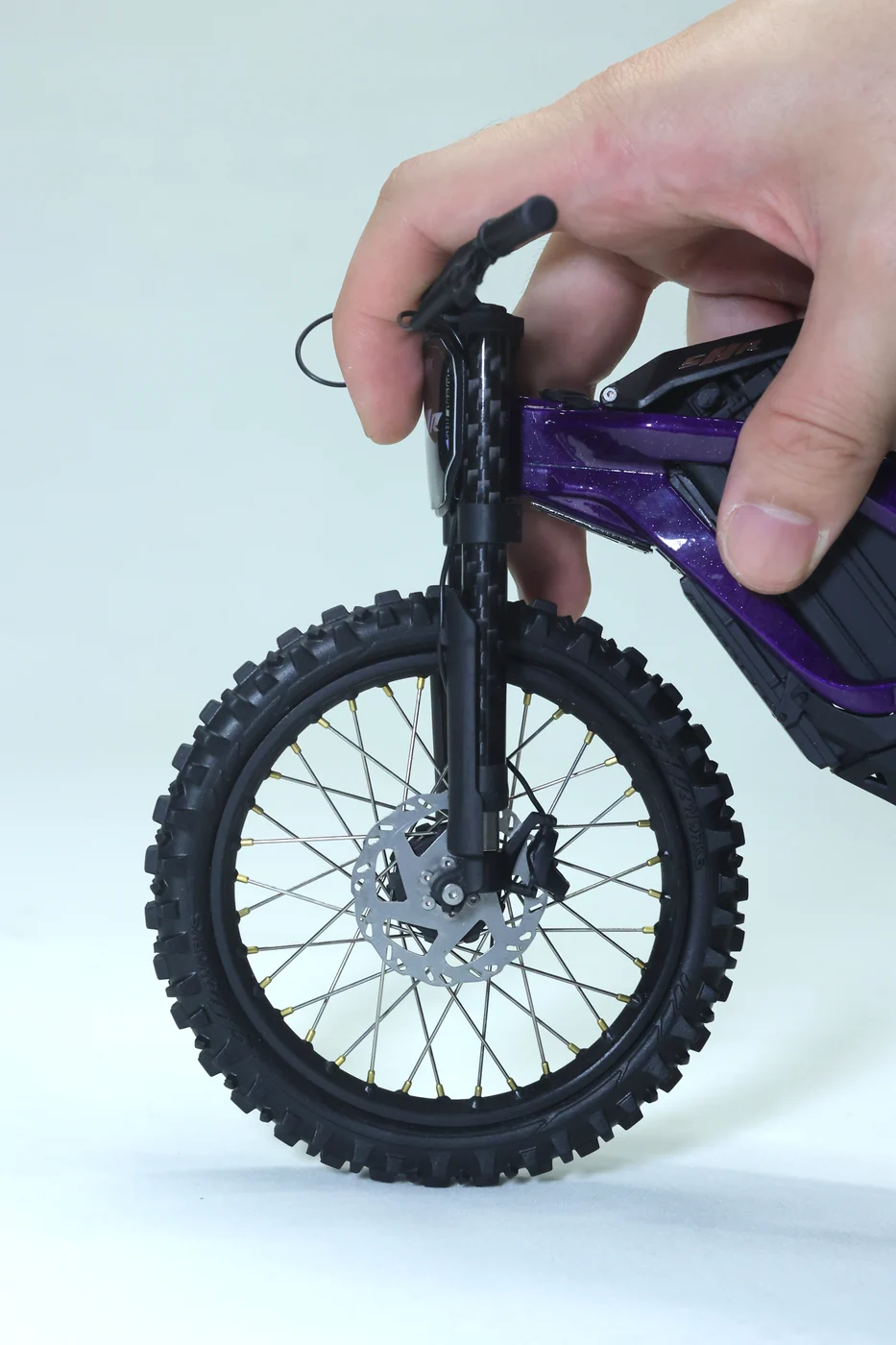 Hand demonstrating the model front suspension
