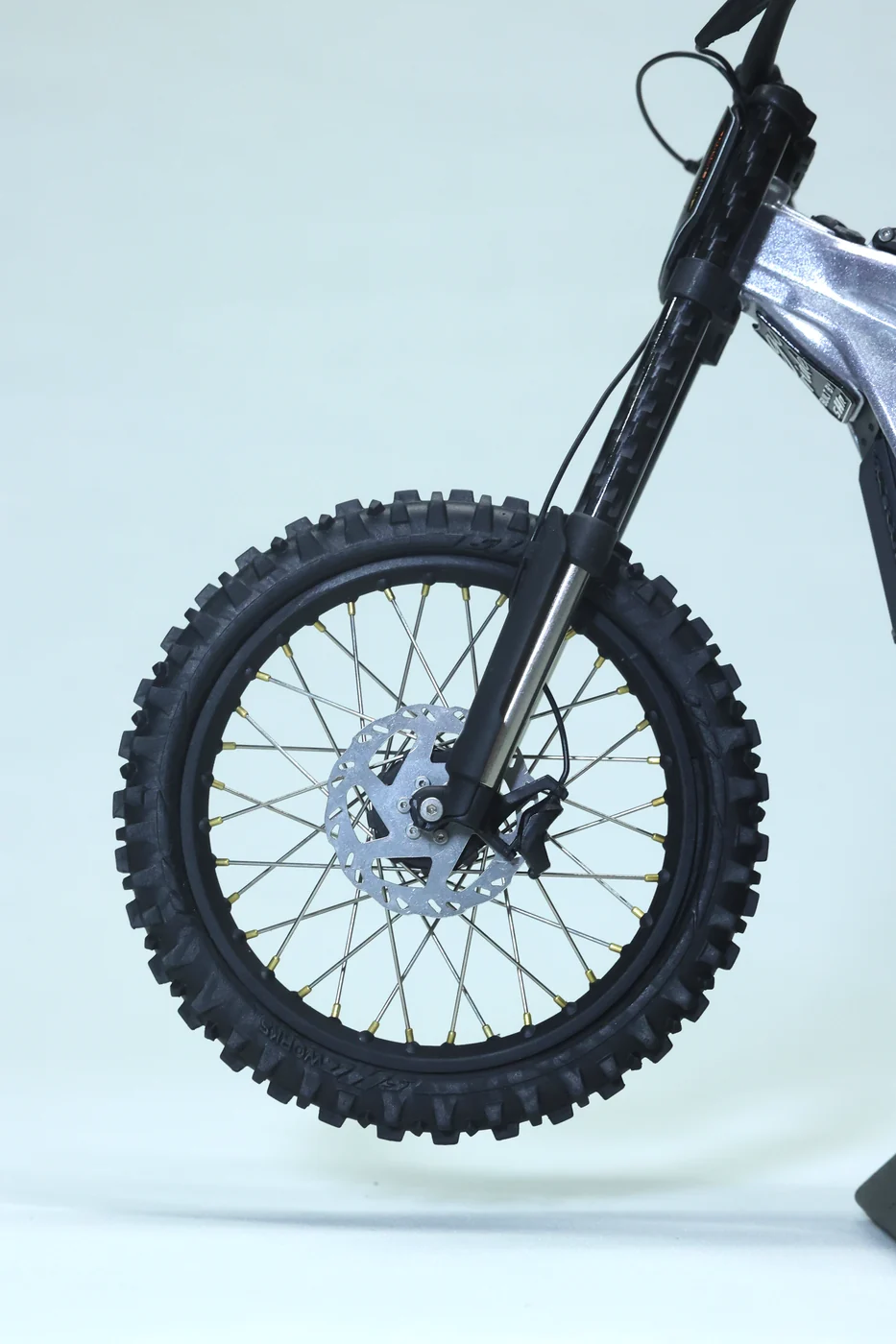 Front wheel, spokes and brake rotor of the silver Light Bee model