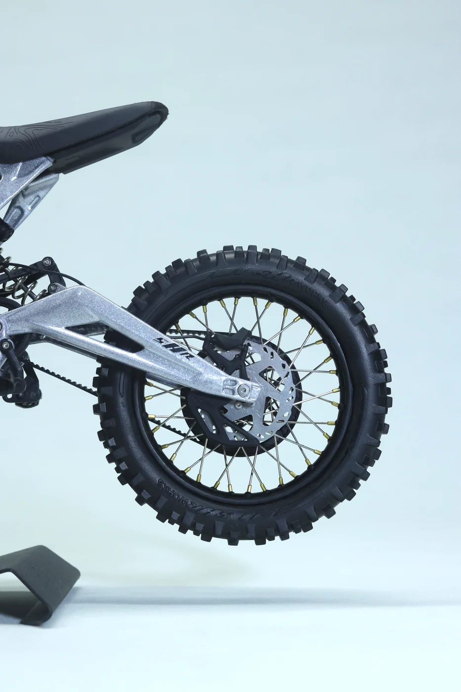 Rear wheel and swingarm of the silver Light Bee model
