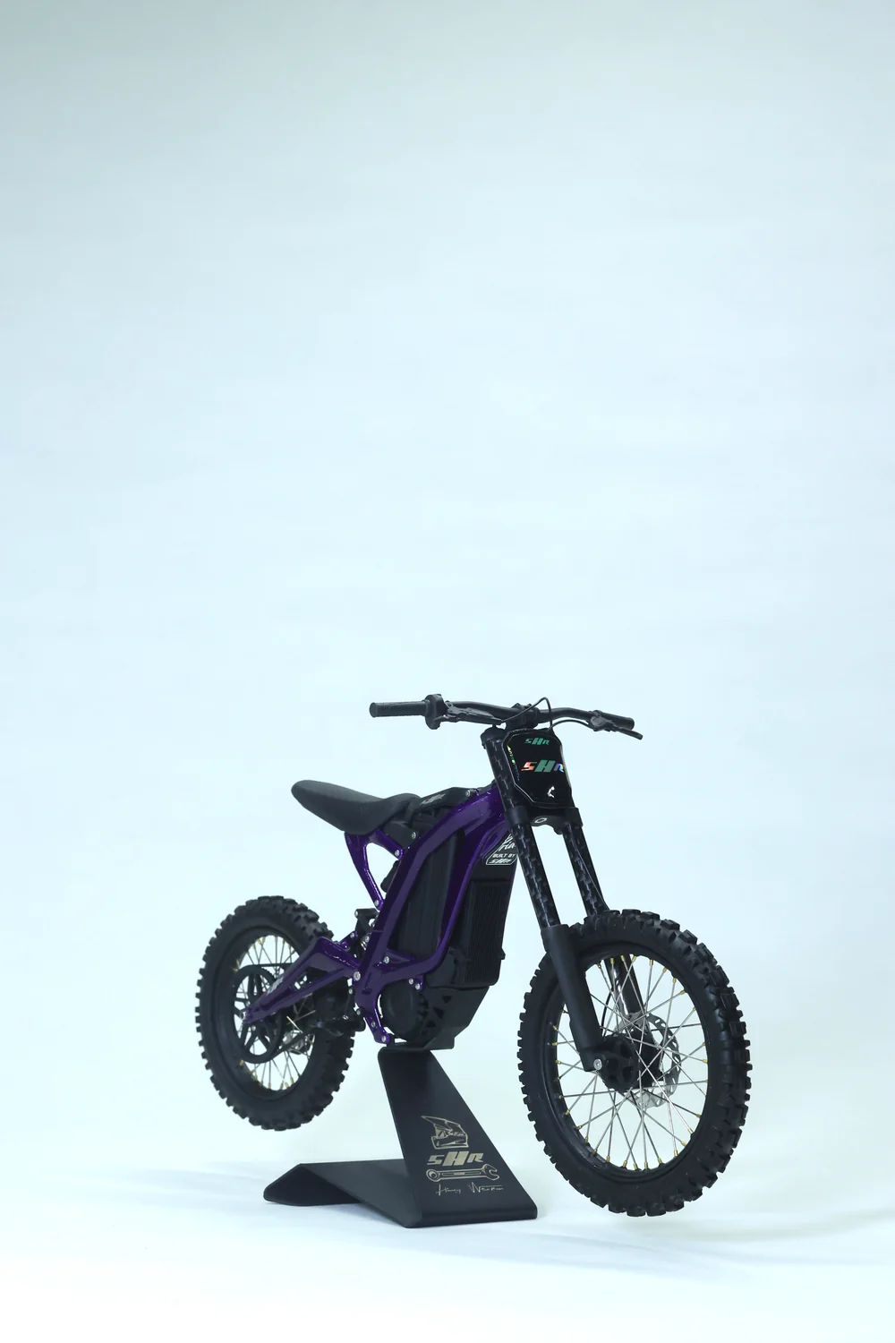 Purple Light Bee 1:6 model on its display stand under neutral lighting